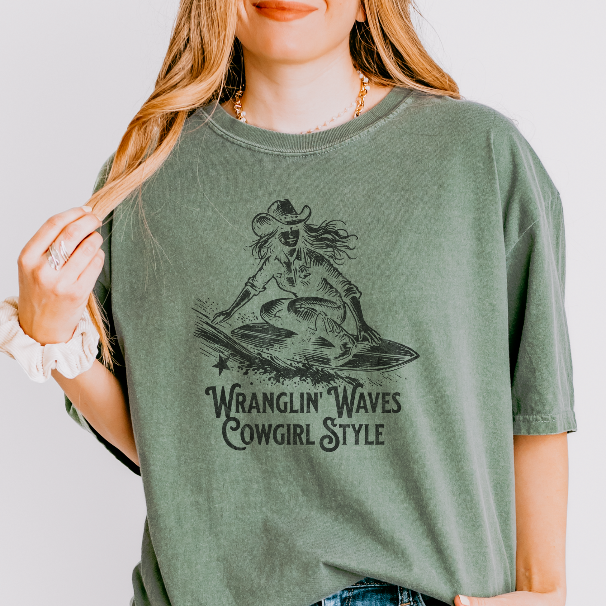 a woman wearing a green wranglin waves t - shirt